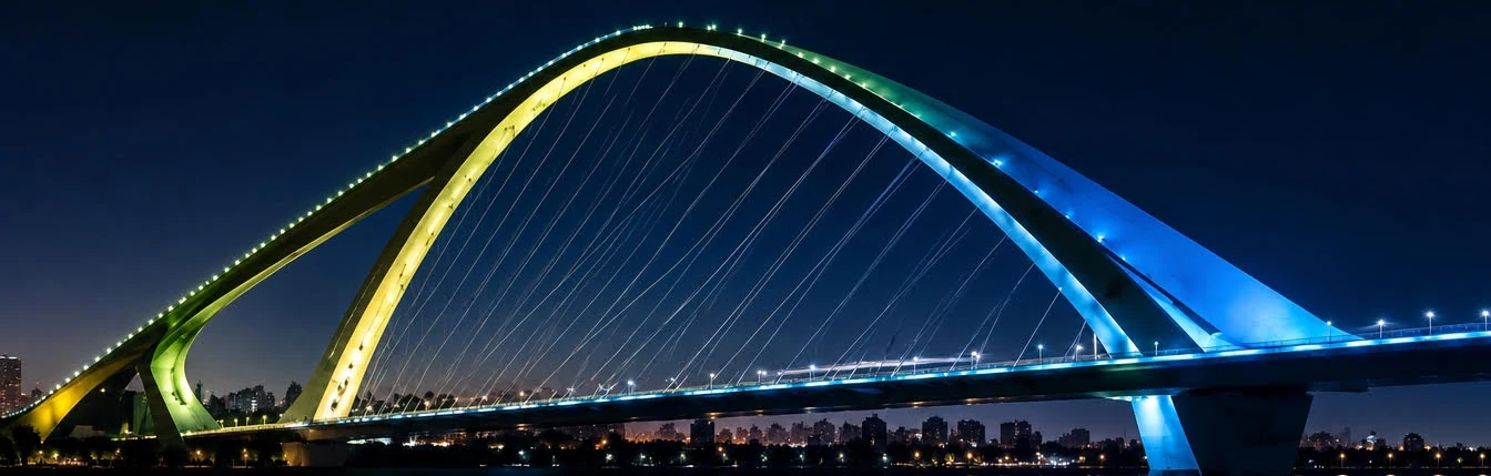 Illuminated arch bridge at dusk